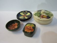 2 Moorcroft ashtrays, 1 Moorcroft covered dish, a Moorcroft trinket box & a Moorcroft small dish