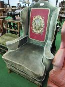 Large wing back armchair with tapestry panel. Estimate £20-30.