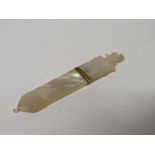 Palias Royal style early 19th century carved mother of pearl needle case. Estimate £100-150.