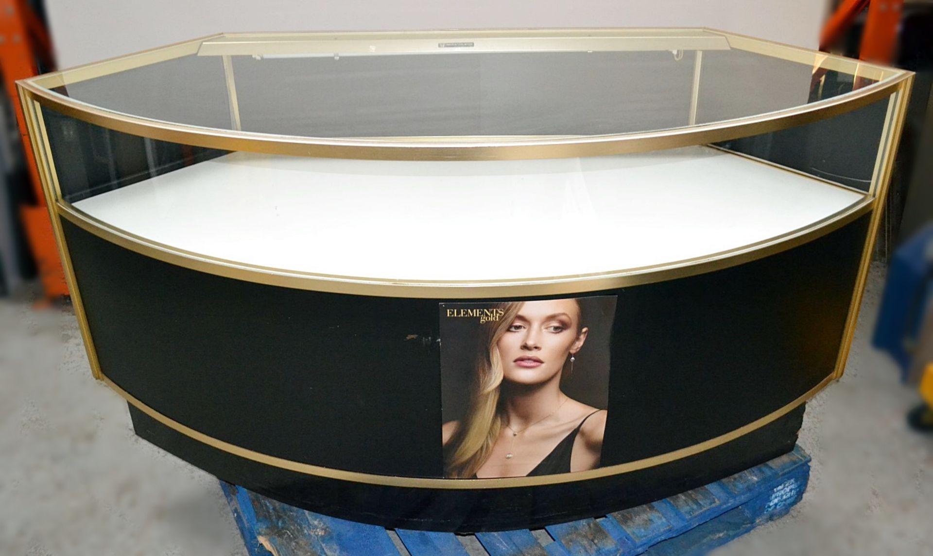 1 x Curved Retail Display Counter In Gold and Black, With Illuminated Glass Display