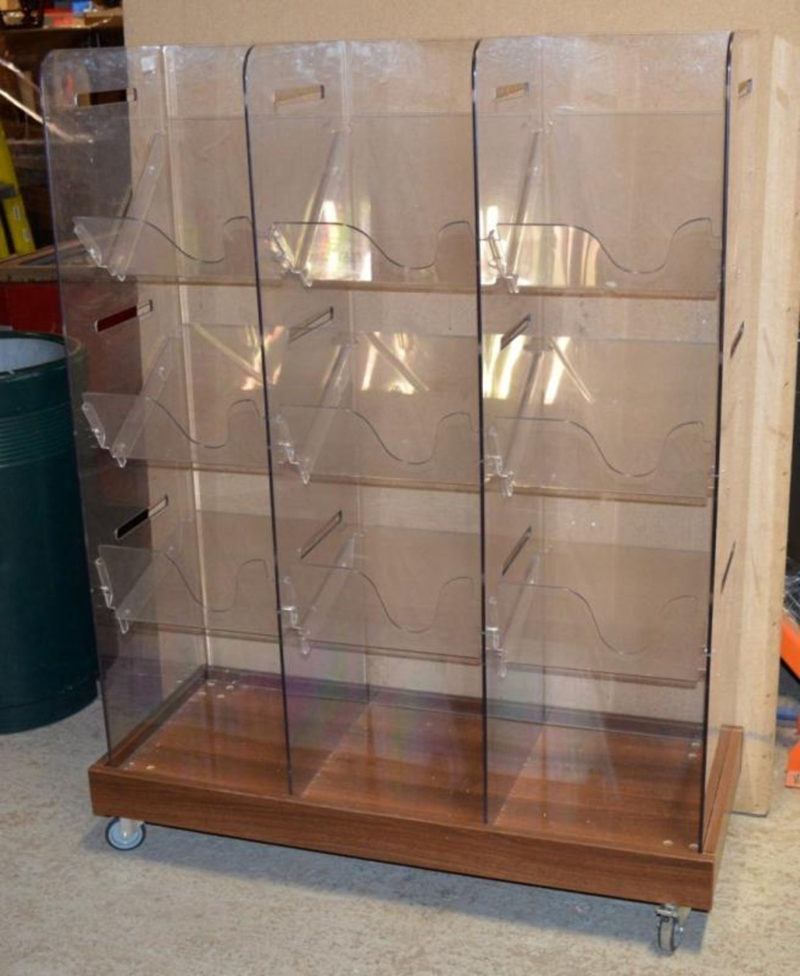 1 x Retail Magazine / Newspaper Display Unit - Clear Perspex With Walnut Base on Castors - H141 x