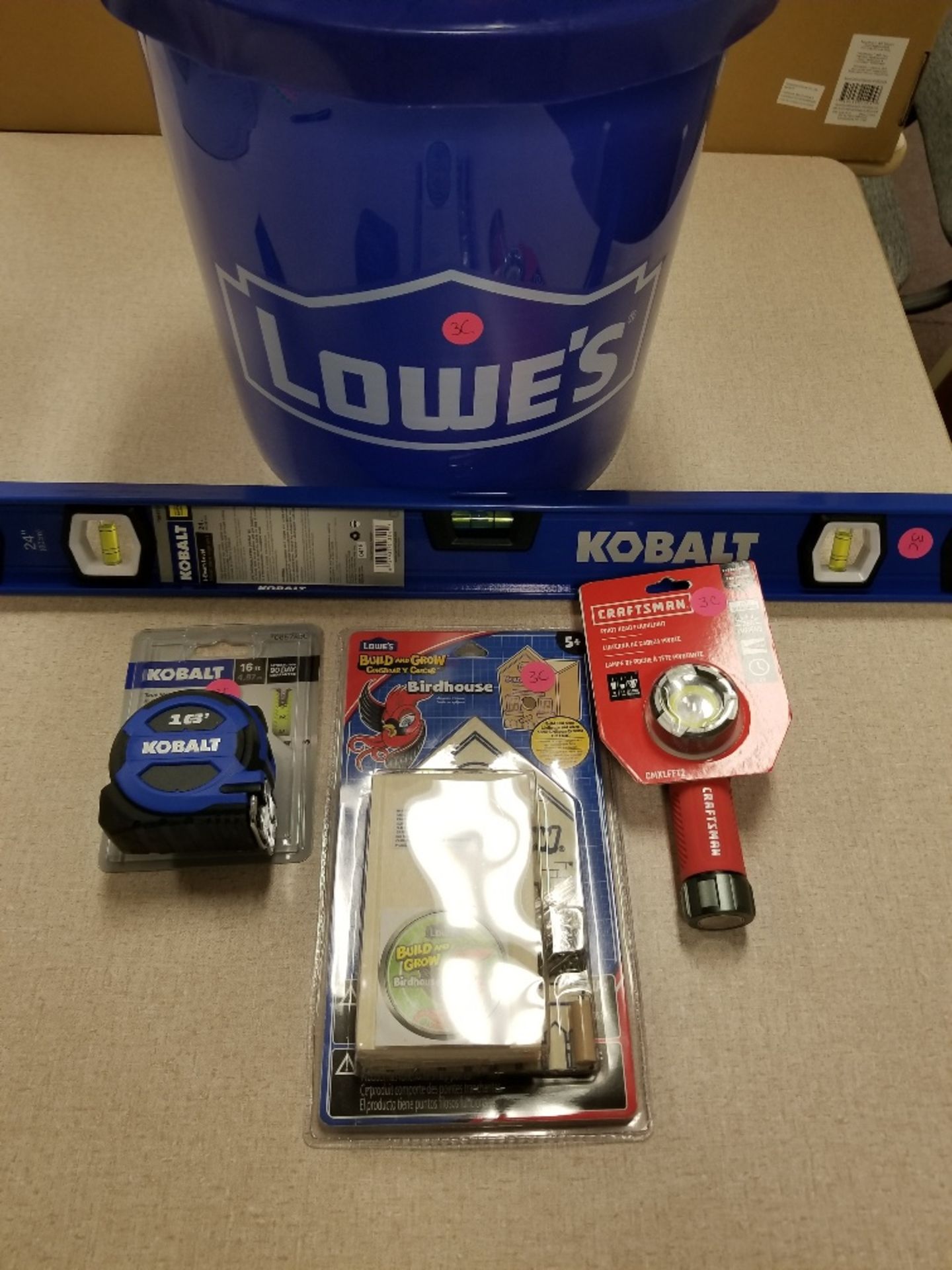 Lowe's bucket w/Kobalt level, 16 ft. tape measure, birdhouse kit, Craftsman flashlight