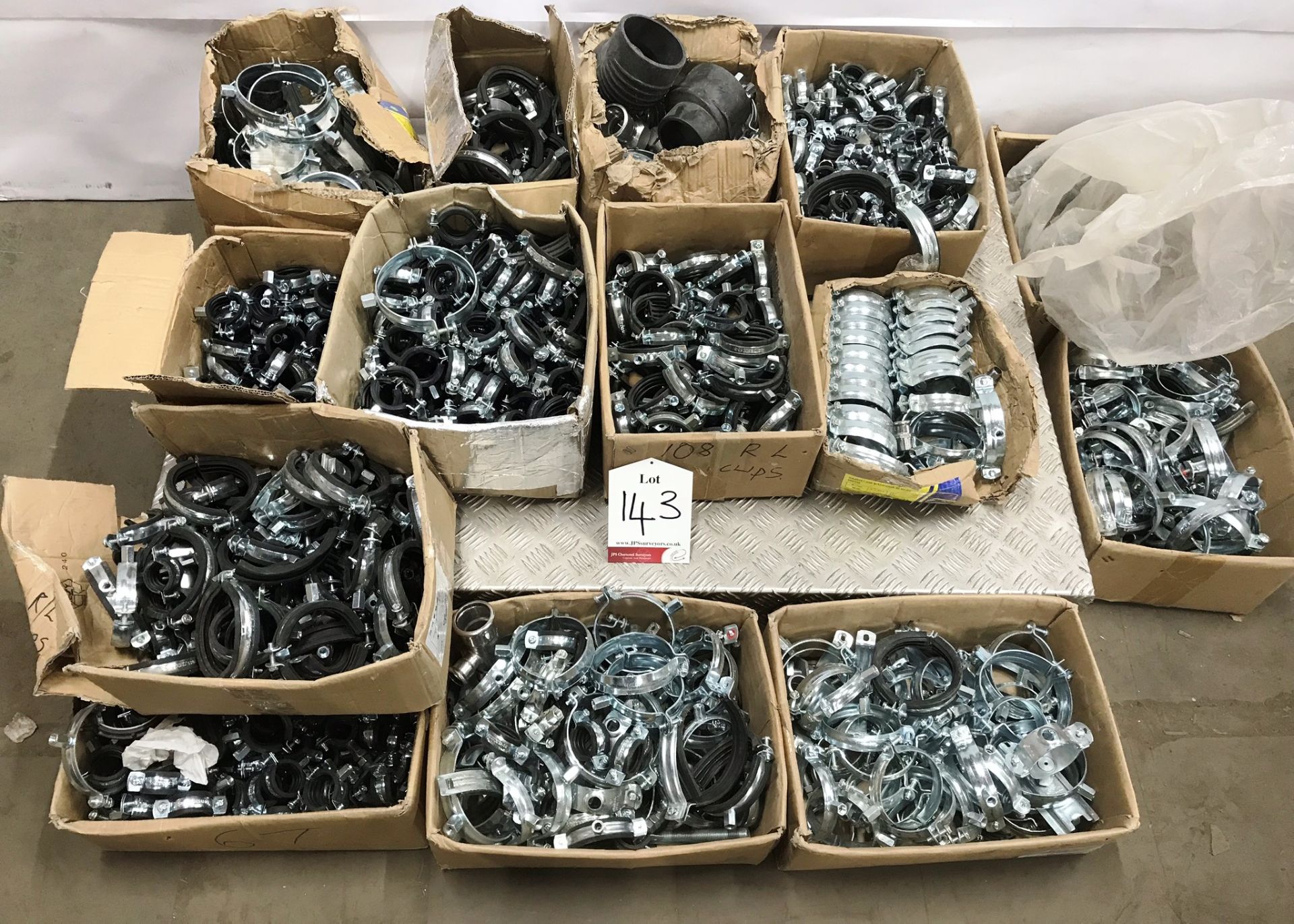 Quantity of various metal pipe clips as pictured