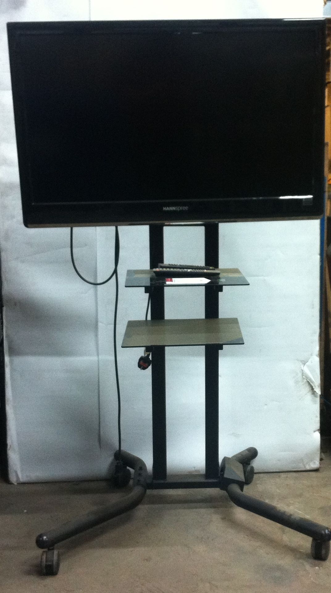 Hannspree Full 1080p 42" LCD TV on stand with wheels