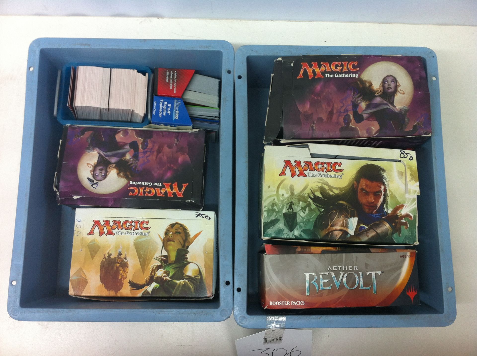 Shelf of Magic The Gathering Trading Cards and related collectables, as photographed.
