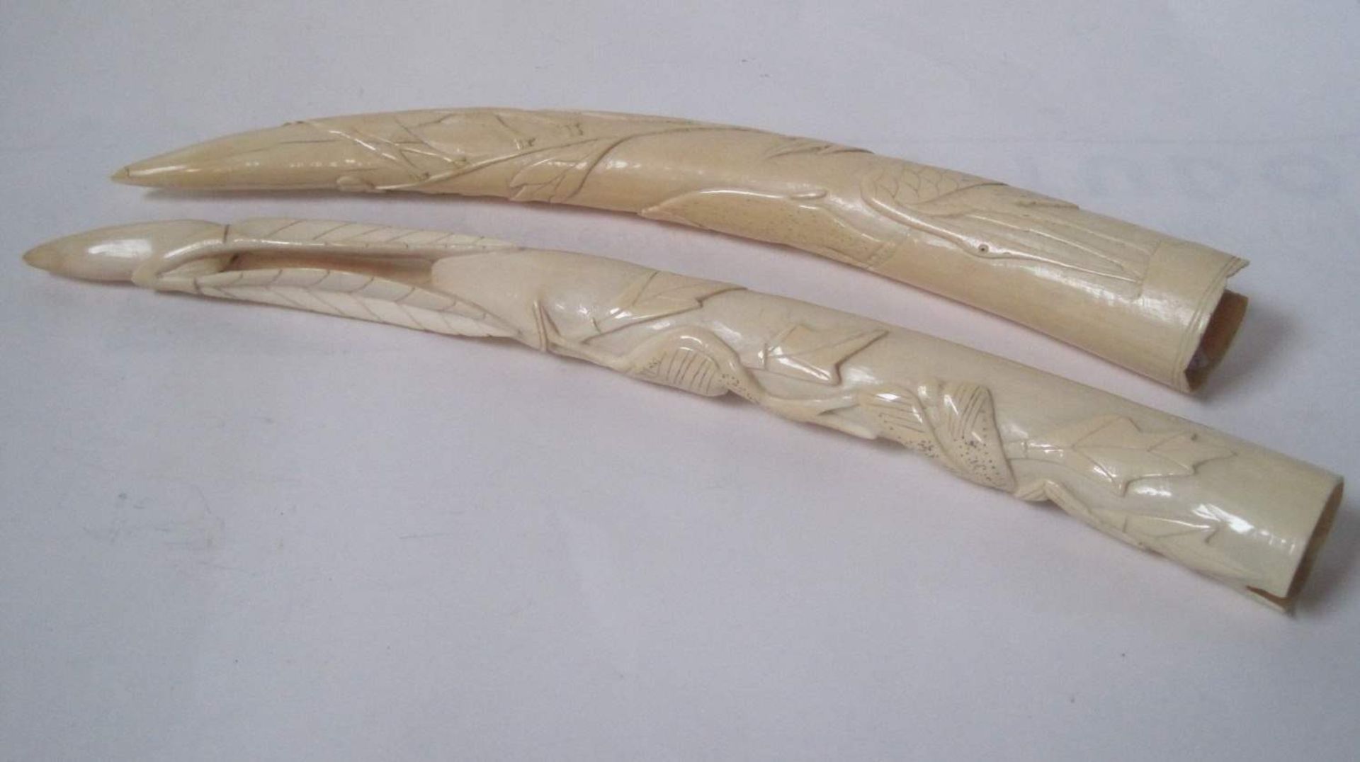 Pair of small carved tusks, 20-30 years, without the stabilizing bases, one with the [...]