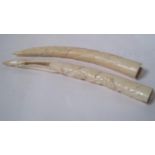 Pair of small carved tusks, 20-30 years, without the stabilizing bases, one with the [...]