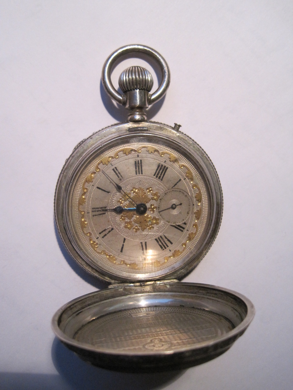 Large pocket watch in sterling silver nineteenth, richly engraved case, partially [...]