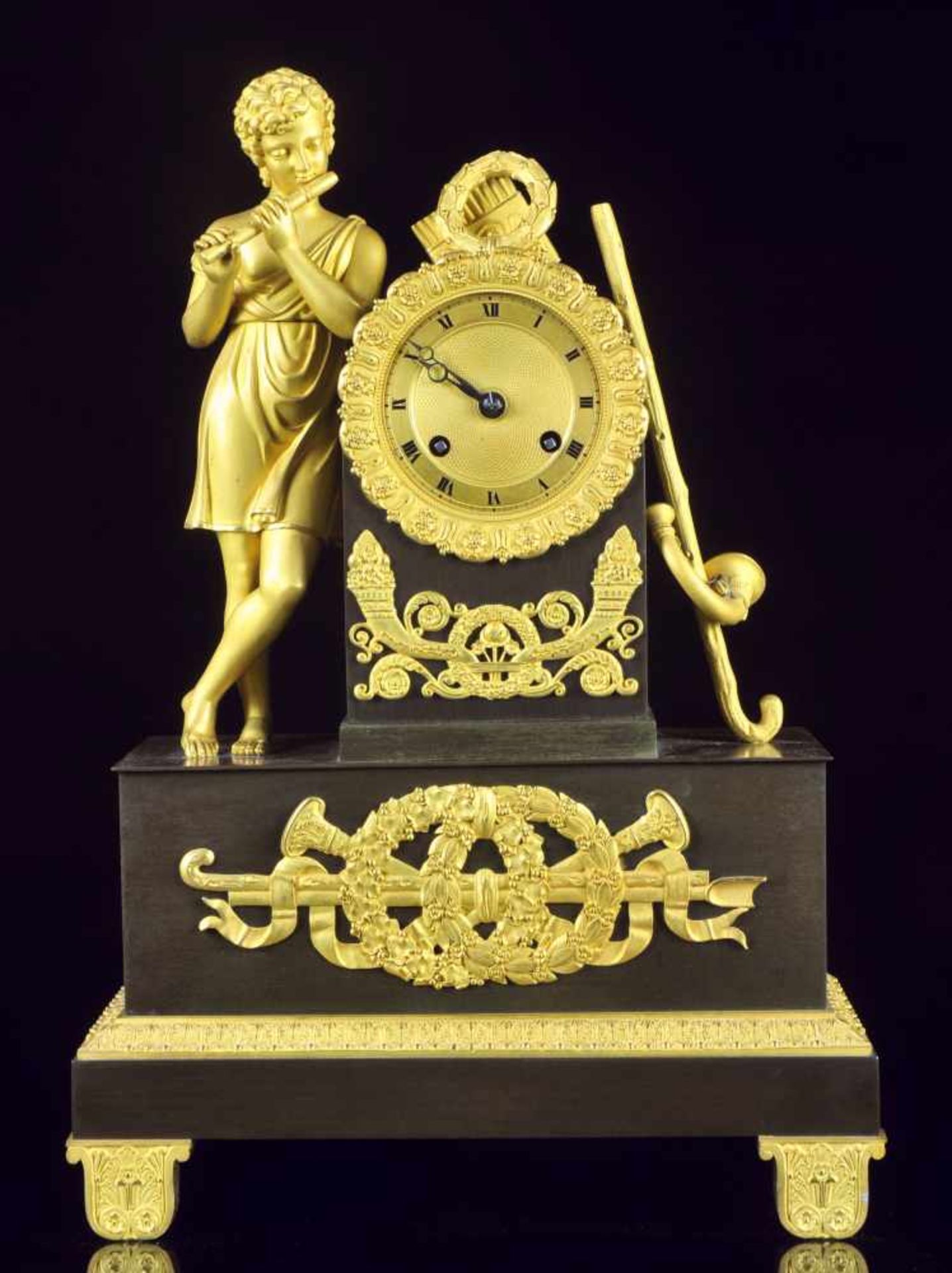 A GILT AND PATINATED BRONZE FIGURAL CLOCK, EMPIRE / RESTORATION PERIOD, FRANCE 1820-1825Origin: