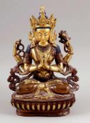 GuanyinChina 20. Jahrhundert. Bronze, teils goldfarben. H. 21 cm. Die Bodhisattva thront in