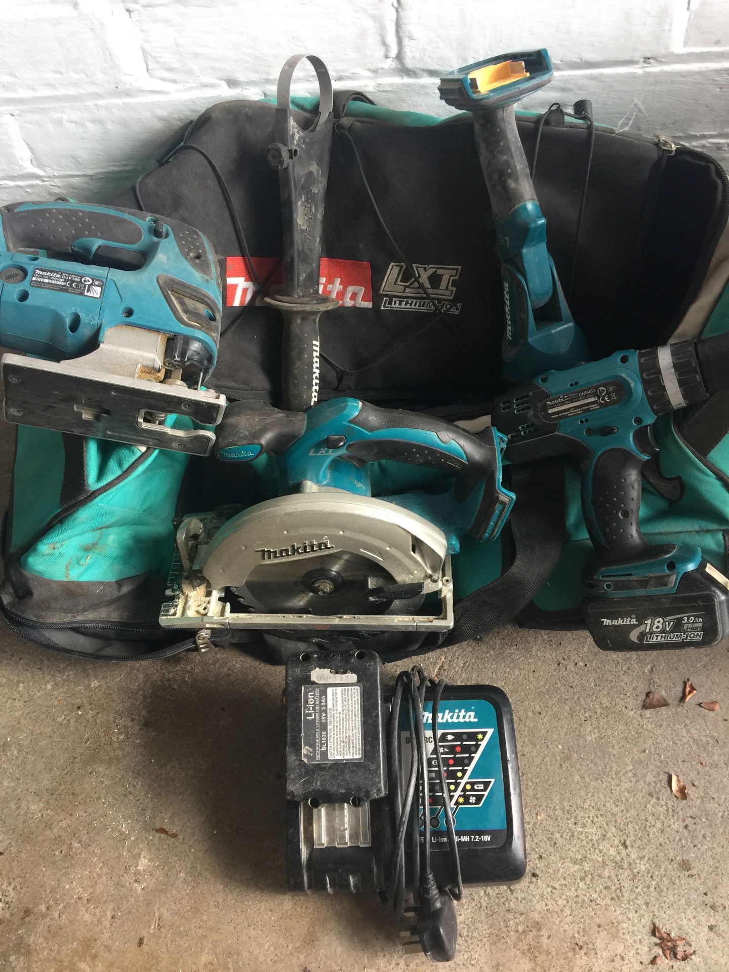 Assorted Makita rechargeable power tools with bag