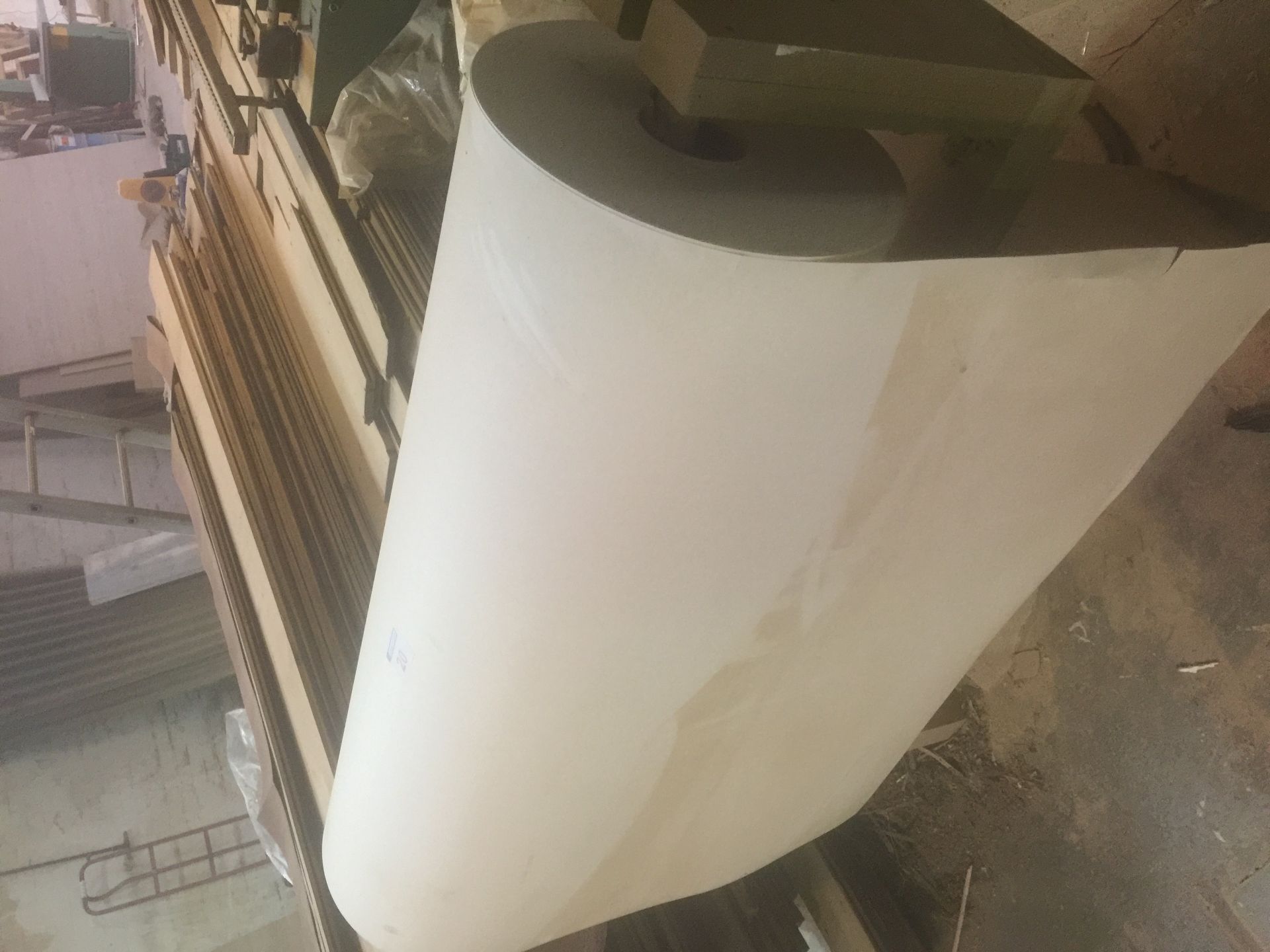 A roll of backing sheet for laminating