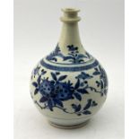 A Japanese Arita apothecary jar, painted in underglaze blue with flowering plants