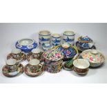 A selection of oriental bowls, spoons, pots and cup & saucers