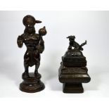 Two bronze sculptures, one of Hanuman, a Hindu Deity, one a Chinese urn with a dog seated on the lid
