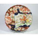 An Imari pattern charger with cranes and a floral decoration