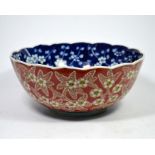 A Japanese bowl in the Imari pattern with prunus blossom interior