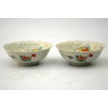 A pair of Japanese porcelain leaf moulded dishes, painted n the Kakiemon style