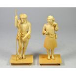 A pair of Indian ivory figures, carved as natives