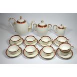 A Limoges art deco coffee set by Depier Refriche, ribbed and hand painted in orange, gold and black