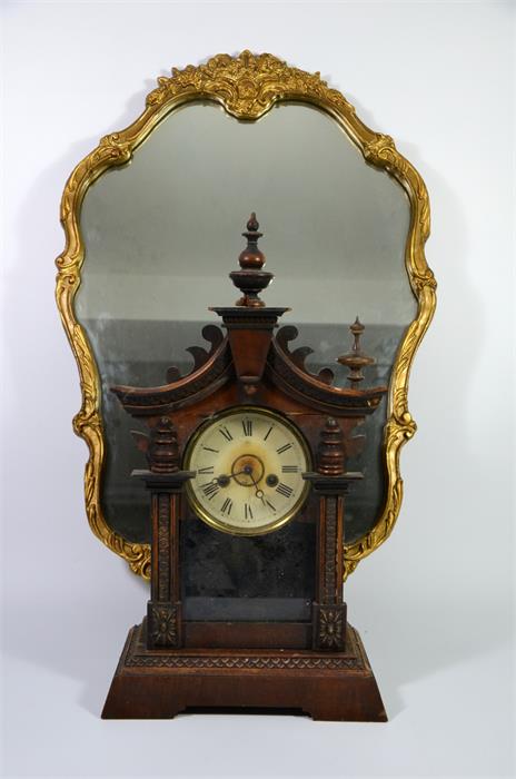 An American style clock and a gilt framed mirror, circa 1930