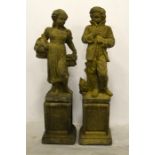 A pair of garden statue ornaments depicting winter and spring as children