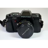 A Pentax P30 camera in a leather case