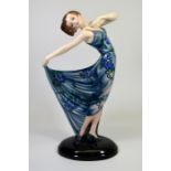 A large Goldscheider glazed figure of a posed dancer designed by Josef Lorenzl