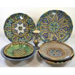 Four chargers, two bowls and one vase in an Islamic style