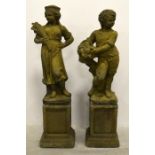 A pair of garden statue ornaments depicting summer and autumn as children