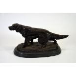 A bronze dog in the manner of Mene