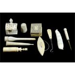 A group of bone carved sewing accessories