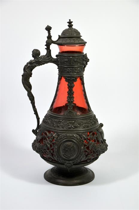 A 19th century Bohemian base metal ruby glass claret jug, renaissance style