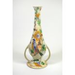 A Gouda Zuid Holland twin handled vase, with decoration of a bird amongst foliage