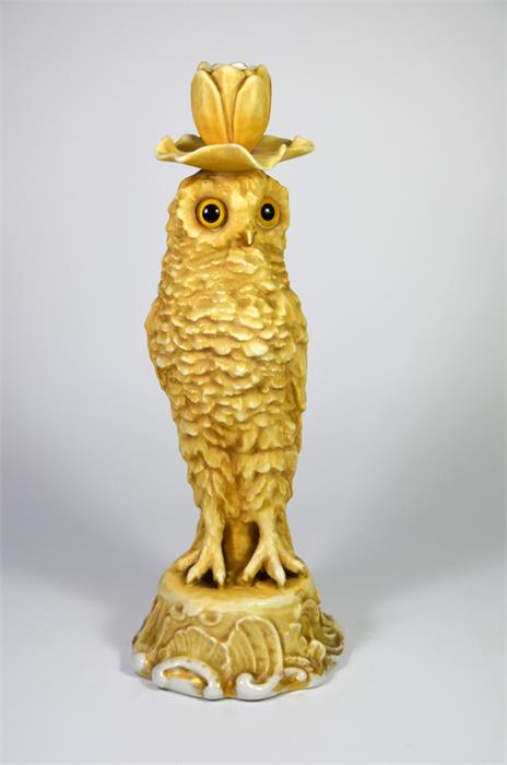 A Sitzendorf porcelain figure of an owl candlestick