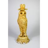 A Sitzendorf porcelain figure of an owl candlestick