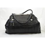 An Aquascutum Handbag, black with stainless steel fastenings