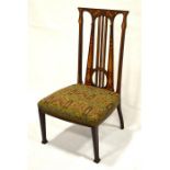 An arts and crafts J.S. Henry inlaid mahogany nursing chair, with original brocade fabric