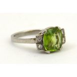 A five stone peridot and diamond ring