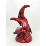 A Royal Doulton prototype flambe model of a group of otters