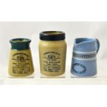 Two small Express Dairy pots with blue and green tops