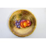 A Royal Worcester fruit decorated, rope edged, tea plate