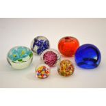 A collection of glass paperweights