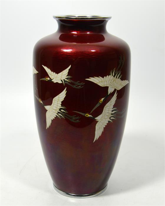 A Japanese Ginbari enamelled vase, on a red ground decorated with cranes, by Ando Jumei