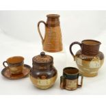 A collection of Doulton stoneware tavern vessels