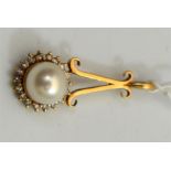 A yellow metal, pearl and diamond cluster pendant