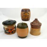 Four Doulton stoneware tobacco jars