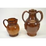 A Doulton Lambeth salt-glazed stoneware beer jug and one other