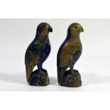 A pair of Oriental carved lapis parrots