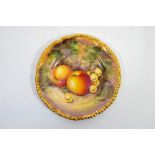 A Royal Worcester fruit decorated,rope edged, tea plate